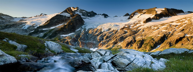 雪山绿色高山夕阳jpg设计背景_新图网 https://ixintu.com 夕阳 山峰 山顶 海报banner 白雪 纹理 质感