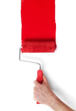正红色墙壁油漆滚筒刷高清图片