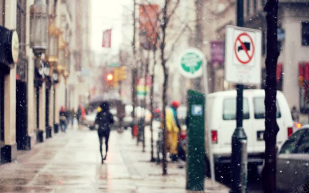 城市街景行走在雪中的人背景
