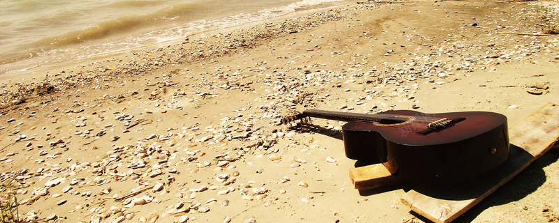 沙滩吉他背景摄影图片