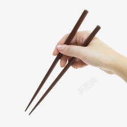 手拿筷子夹菜素材