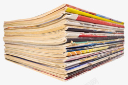 一叠报纸彩色破烂堆起来的书实物高清图片