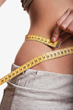 节食女人实物测量腰围的女人高清图片