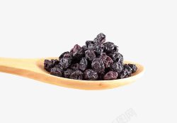 莓干勺子上的蓝莓高清图片