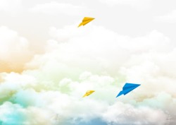 彩色纸飞机蓝天白云纸飞机背景高清图片