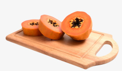番木瓜红色营养在砧板上被切成圆的熟木高清图片