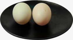 食品电商黑色盘装两枚土鸭蛋高清图片
