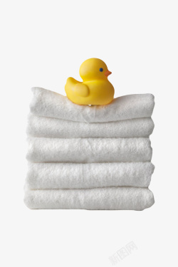橡胶鸭黄色玩具在白色层叠毛巾上的橡胶高清图片
