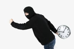 蒙面人物蒙面小偷拿着时钟试图逃跑侧高清图片