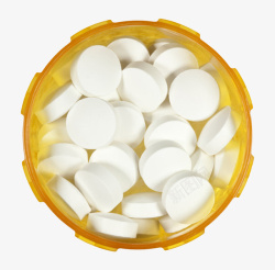 化学药物白色治愈黄色瓶子里的西药片实物高清图片