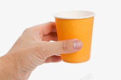橙色杯子手拿橙色纸杯高清图片