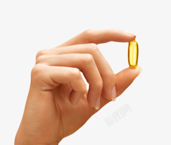 淡黄色透明治愈手指捏着的西药片素材