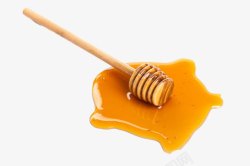 搅拌蜂蜜的木棒黄金蜂蜜高清图片