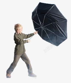 打着伞的男孩风中的小男孩高清图片
