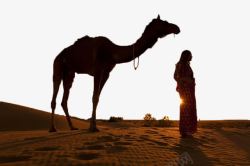 黄昏大漠荒漠下的骆驼人物高清图片