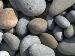 粗糙的石头鹅卵石背景高清图片