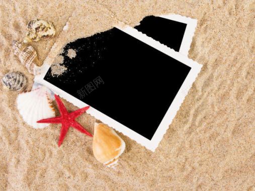 电子相框沙滩上的相片摄影图片