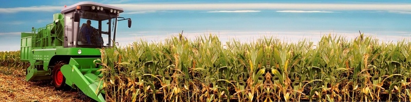 农业收割丰收玉米收割机背景摄影图片