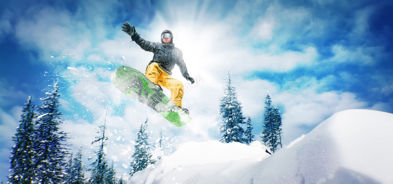 山顶上冲出的滑雪运动人物摄影图片