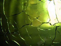 玻璃裂纹绿色玻璃上的裂痕高清图片
