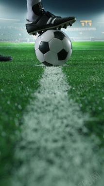 绿色草地上踢足球元素背景图摄影图片