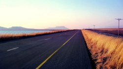 笔直马路笔直马路黄色荒草海报背景高清图片