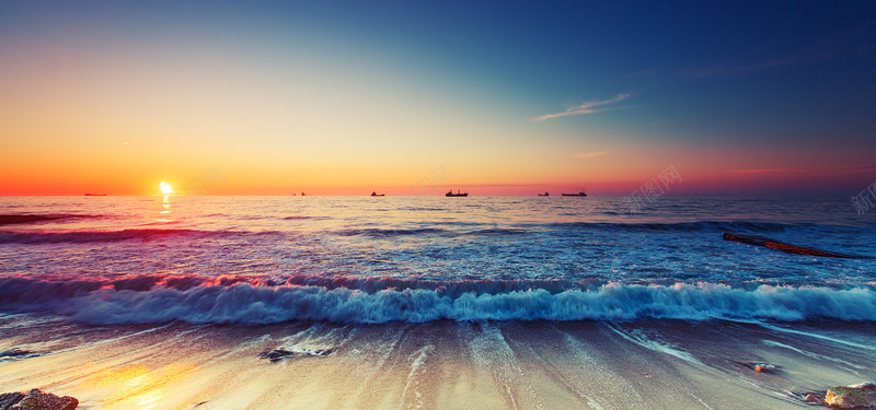 沙滩海浪太阳升背景banner摄影图片