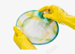 黄色胶皮手套正在洗盘子高清图片