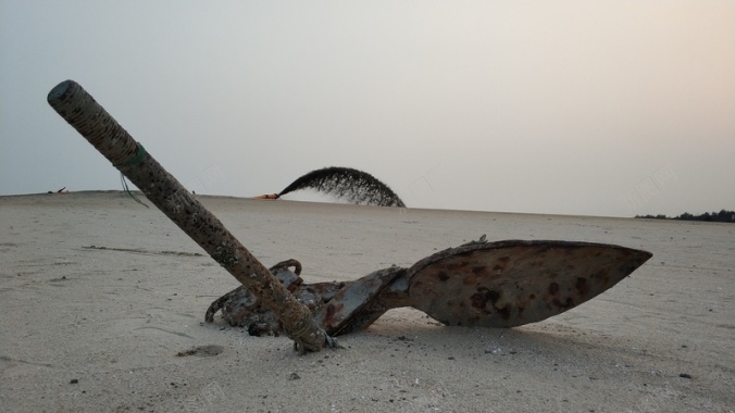 海滩铁锚落日海边背景