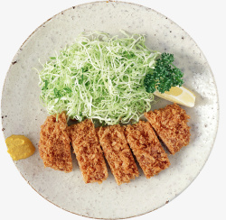 一盘沙拉油炸猪排配蔬菜丝的美食高清图片