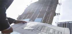 房地产科技感拿建筑图纸的工人地产背景高清图片