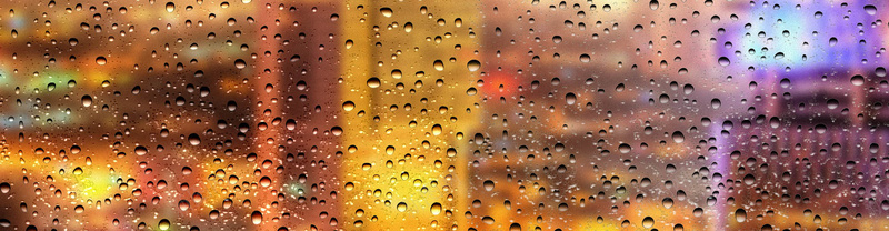雨滴雨后的城市玻璃窗背景
