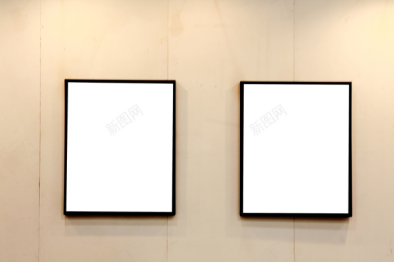 墙上挂的两幅空白画框背景