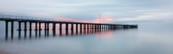 日落地平线摄影海岸上的桥背景高清图片