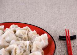 筷子摄影餐盘里的饺子摄影背景高清图片