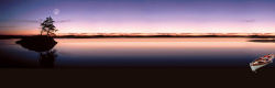 夕阳下的风景夕阳下海上游船唯美背景banner高清图片