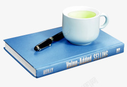 书本上的咖啡杯蓝色书本上的咖啡杯高清图片