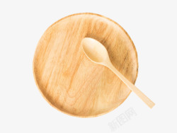 棕色圆形碟子上的木汤勺实物素材