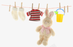条纹袜子吊着的玩具兔子高清图片