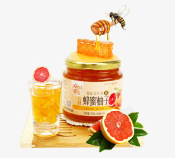 绿色的蜜蜂木板上蜂蜜柚子茶高清图片