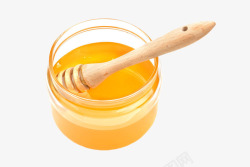 蜂蜜棒子杯子里的蜂蜜糖浆高清图片