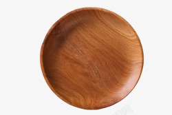 食物摆盘深棕色木质纹理凹陷的圆木盘实物高清图片