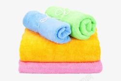 卷着的毛巾绿蓝色卷着的毛巾和黄紫色毛巾层高清图片
