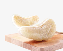 白柚黄色木盘子上的白肉柚高清图片