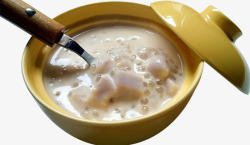 西米椰奶瓷碗里的椰奶香芋西米露高清图片