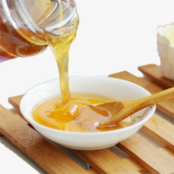 纯天然土蜂蜜倒在碗里面的土蜂蜜高清图片