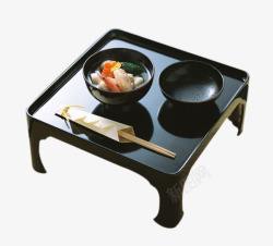 食碗黑色小茶几上的黑色碗和筷子高清图片
