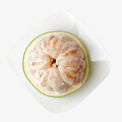 绿皮红心盘子里的水果蜜柚高清图片