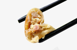 肉馅煎饺筷子夹起的锅贴高清图片