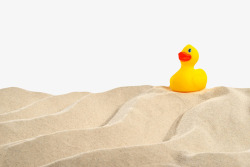 动物沙子黄色玩具在沙漠中行走橡胶鸭实物高清图片